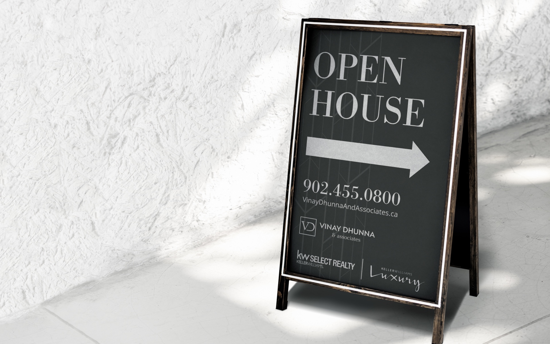 Example of an Open House sign showing Vinay Dhunna's logo and contact information.