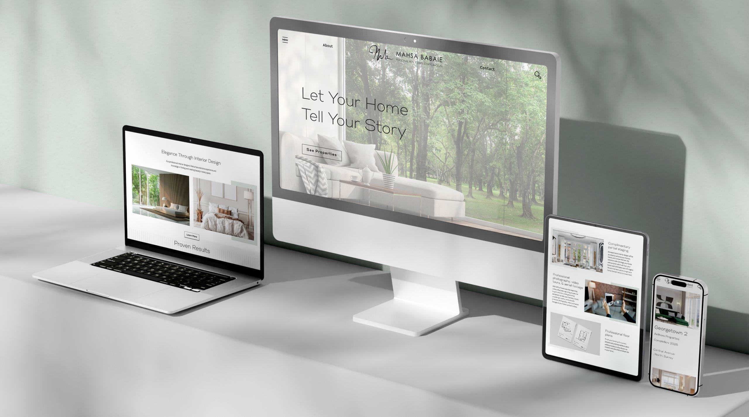 Computers displaying visual choices for Realand's website.