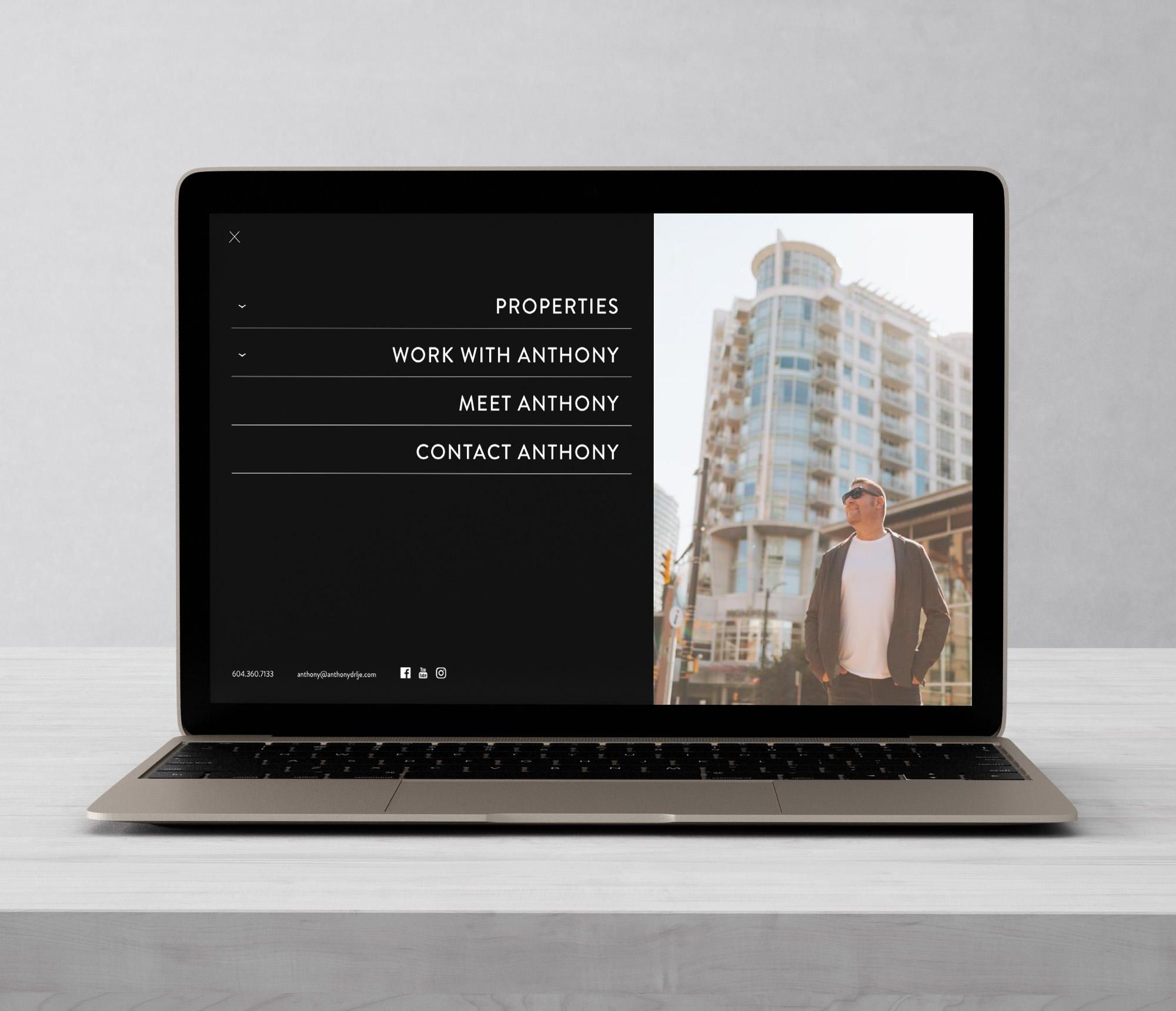 AnthonyDrlje_FullNavWebsite Mockup of a laptop displaying Anthony Drlje's navigation menu of his website.